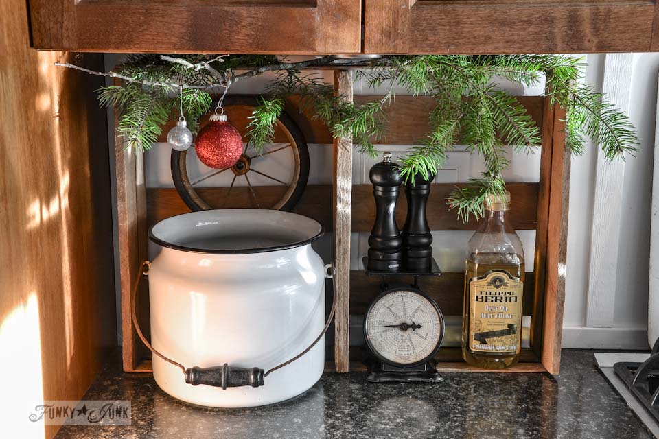 Crate and enamel pail in kitchen / A well lit junky Christmas kitchen / salvaged finds used to deck out this kitchen for Christmas via https://www.funkyjunkinteriors.net/ Crate and enamel pail in kitchen / A well lit junky Christmas kitchen / salvaged finds used to deck out this kitchen for Christmas via https://www.funkyjunkinteriors.net/