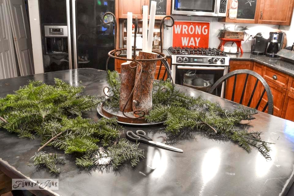 A log candle centrepiece / A junky Christmas kitchen / salvaged finds used to deck out this kitchen for Christmas via https://www.funkyjunkinteriors.net/ A log candle centrepiece / A junky Christmas kitchen / salvaged finds used to deck out this kitchen for Christmas via https://www.funkyjunkinteriors.net/