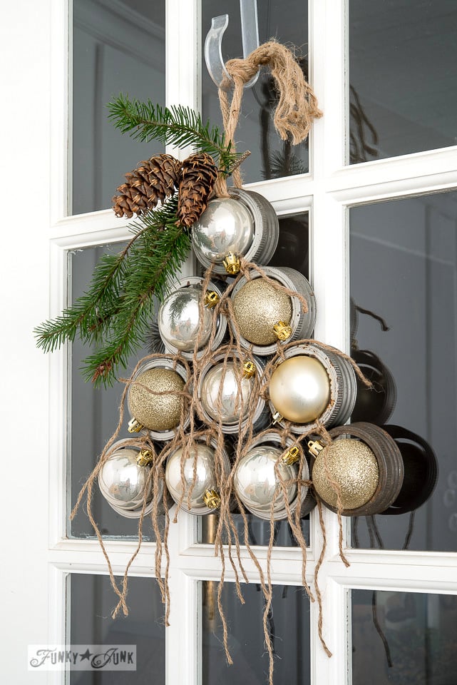 Mason jar lid ornament Christmas tree for a front door on FunkyJunkInteriors.net