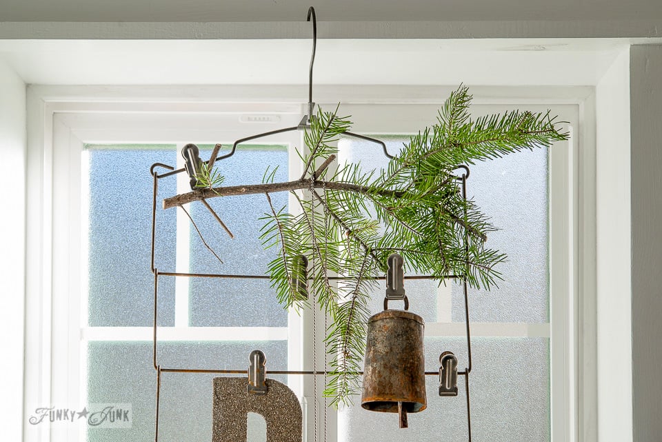Bells on a vintage hanger window display on FunkyJunkInteriors.net Bells on a vintage hanger window display on FunkyJunkInteriors.net