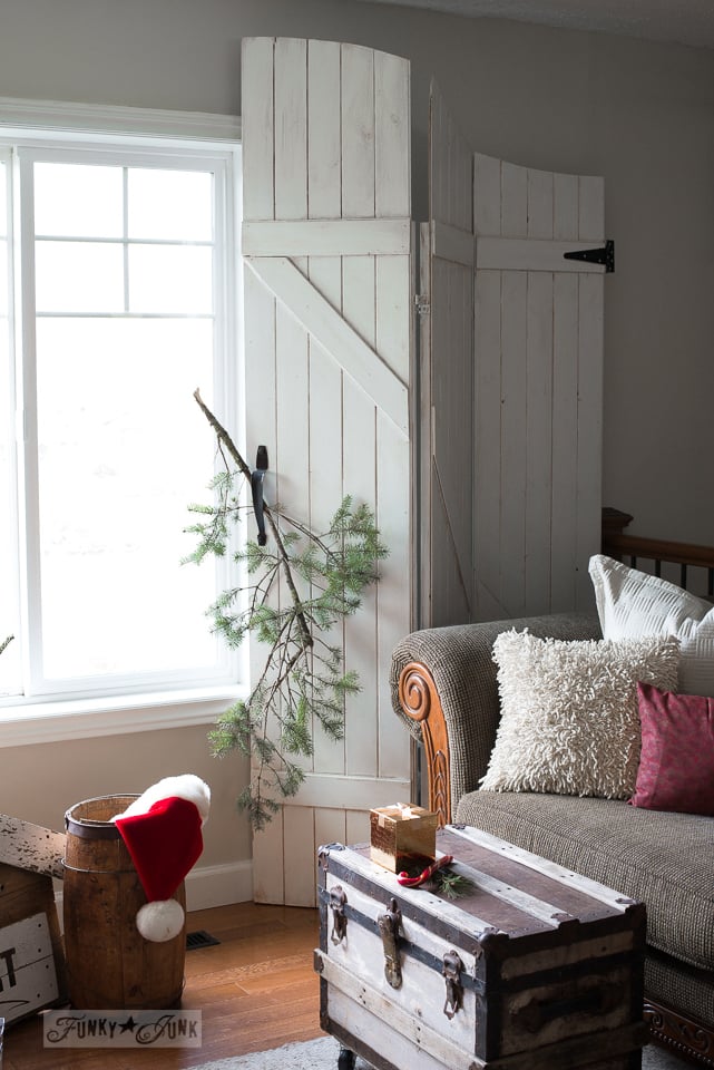 White old gate window screens with evergreen branch for Christmas decorating / www.funkyjunkinteriors.net White old gate window screens with evergreen branch for Christmas decorating / www.funkyjunkinteriors.net