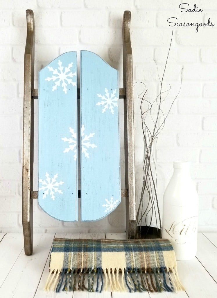 Snowflake stenciled vintage sleigh for winter decor by Sadie Seasongoods, featured on Funky Junk Interiors