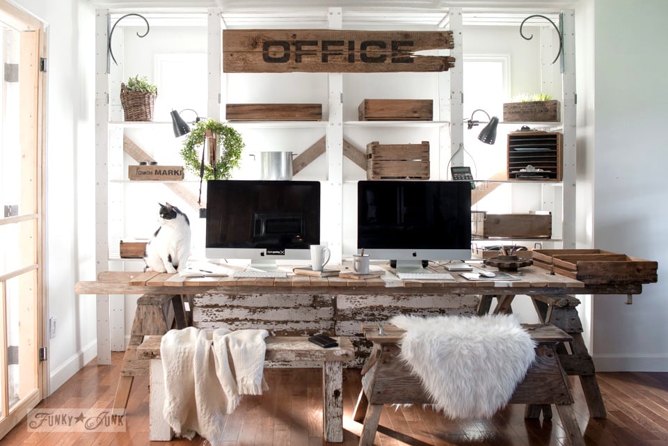 Pallet wood office desk with large sign and rustic benches