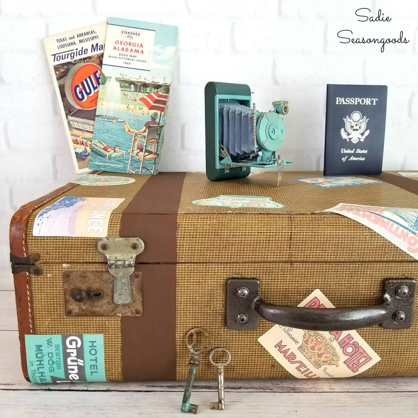 DIY vintage luggage with travel stickers by Sadie Seasongoods, featured on Funky Junk Interiors 