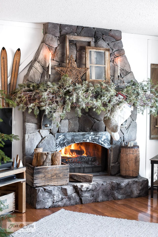 a cozy blanket, leaf pillow and fireplace for fall - Funky Junk Interiors