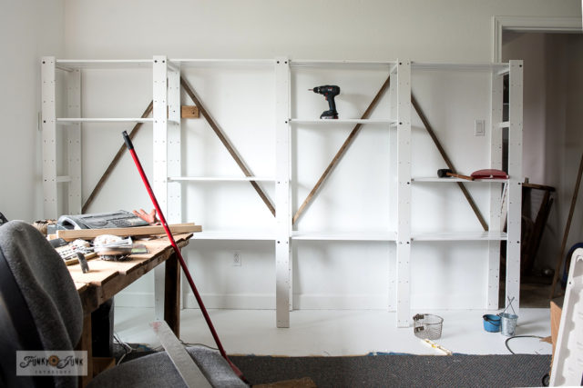 Collection storage on white painted shelving - Funky Junk ...