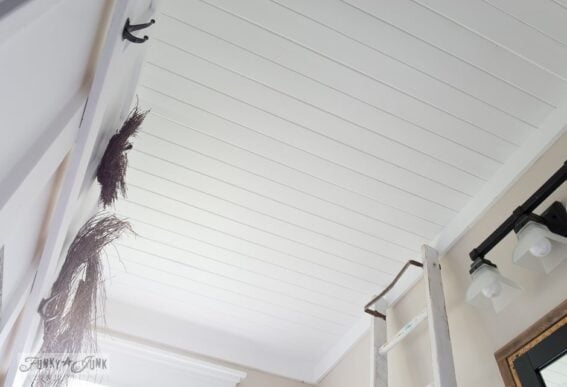 wood ceiling planks over a popcorn ceiling