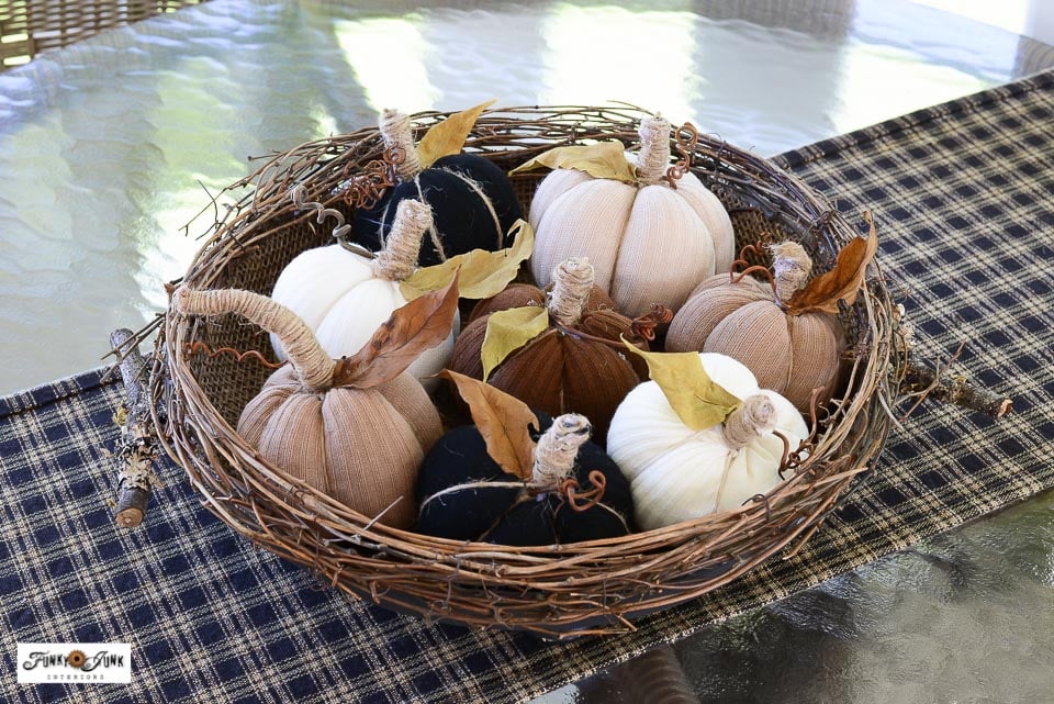 fabric pumpkins made from socks in a rustic bowl