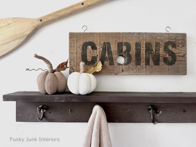 fabric pumpkins made from socks sitting on shelf