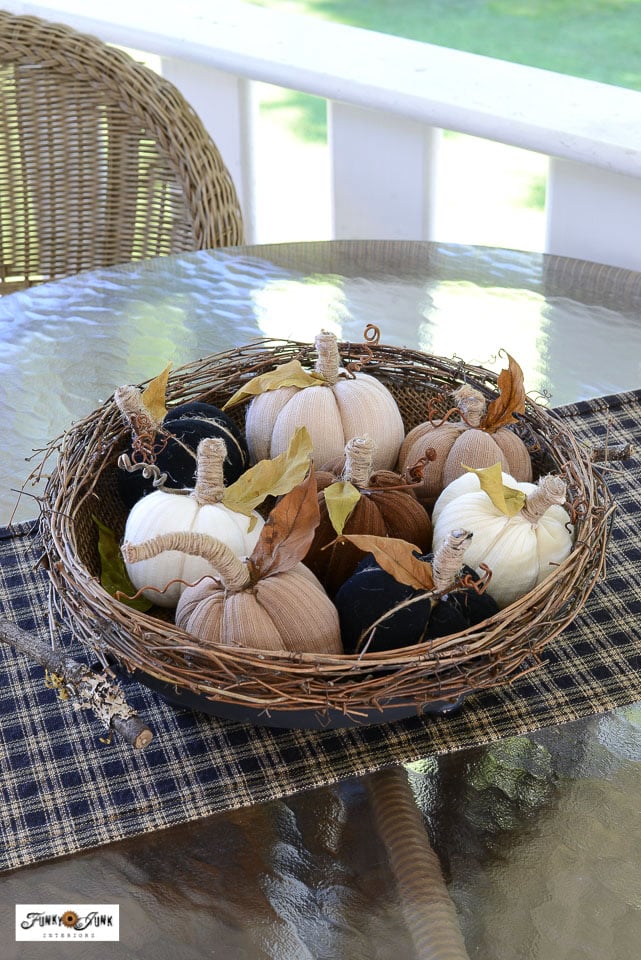 fabric pumpkins made from socks staged in a tray