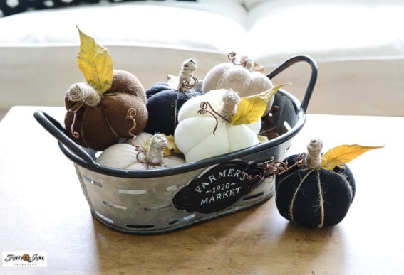 sock pumpkins in galvanized basket