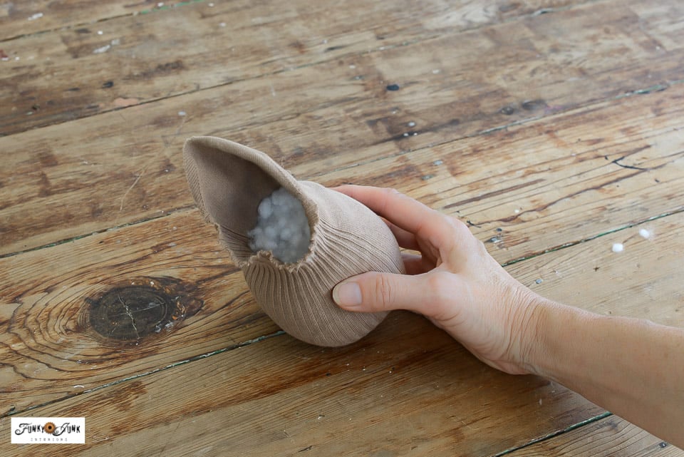 stuffing in a sock to make a fabric pumpkin