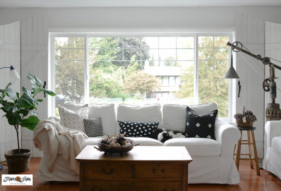 white ikea sofa in front of large picture window