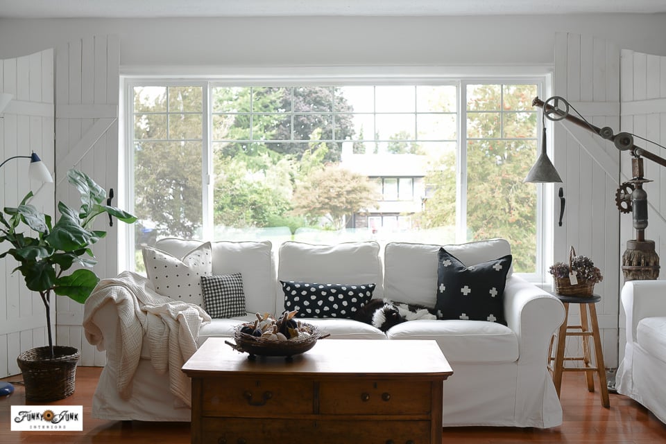 white ikea sofa in front of large picture window