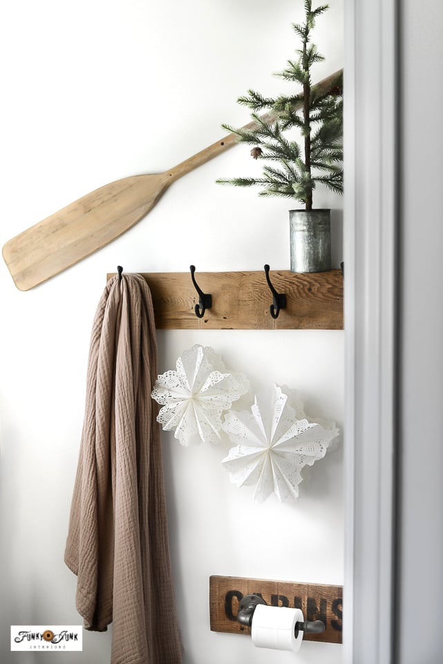 paper doily snowflakes hanging on display