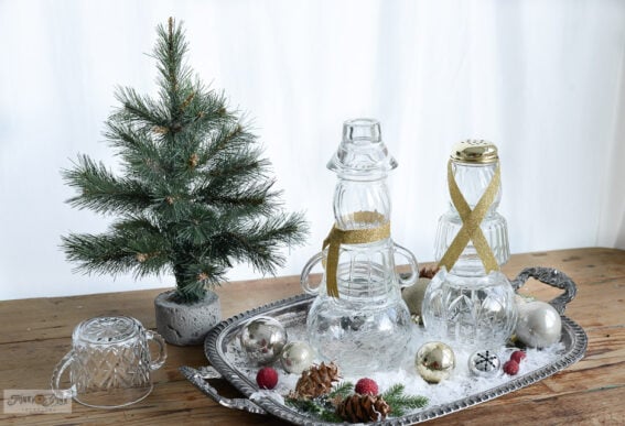 staged glass bowls snowman craft on tray with faux snow