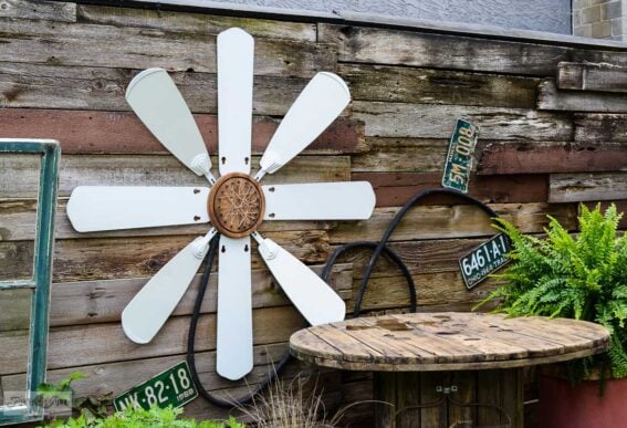 upcycled ceiling fan blade flower yard art