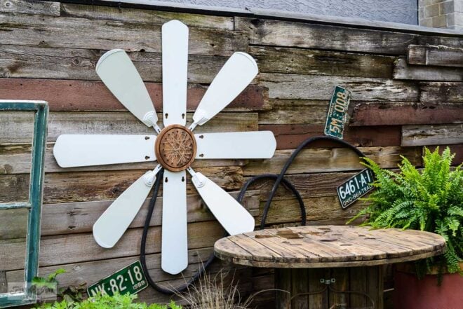 upcycled ceiling fan blade flower yard art