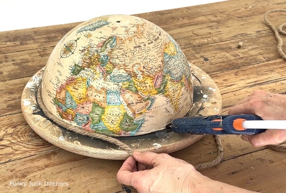 glueing twine onto an upcycled globe cloche