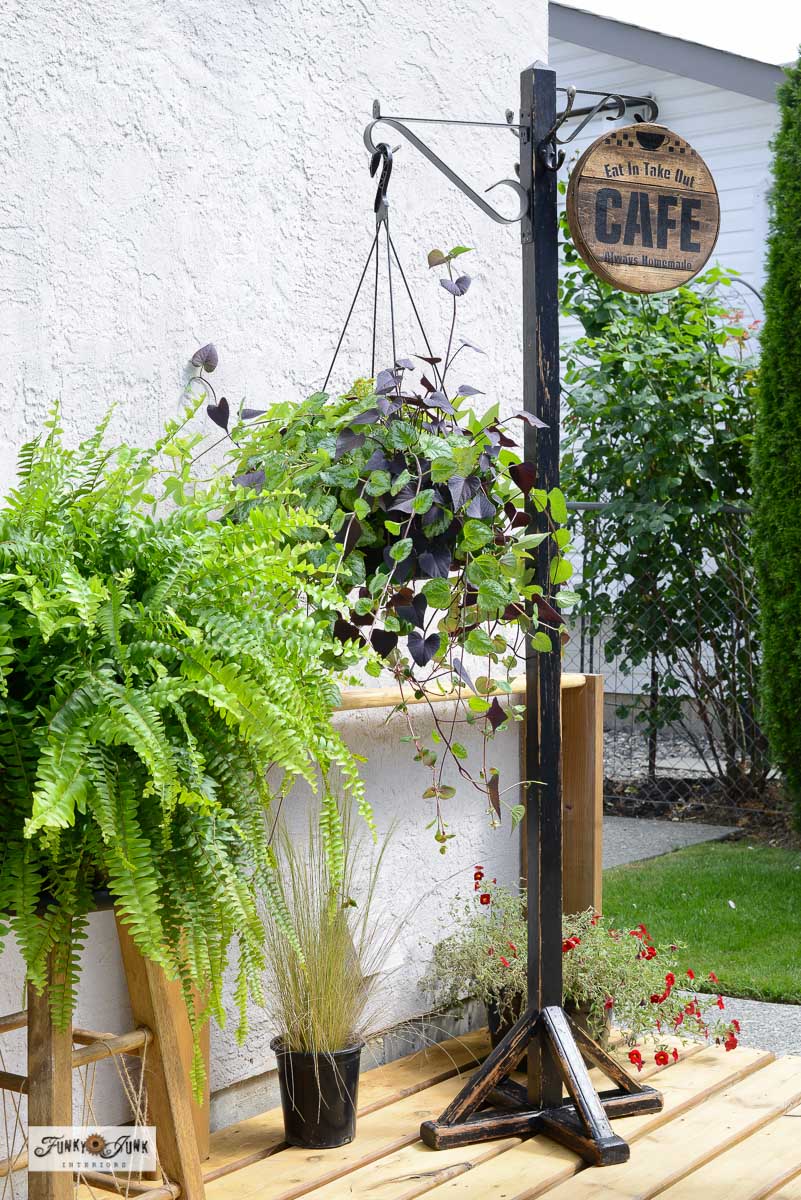 hanging plant stand with Cafe sign from a coat rack featured on New Upcycle Ideas 838