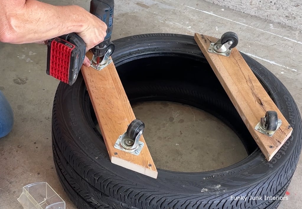 things made with used tires - attaching casters under a tire for an ottoman