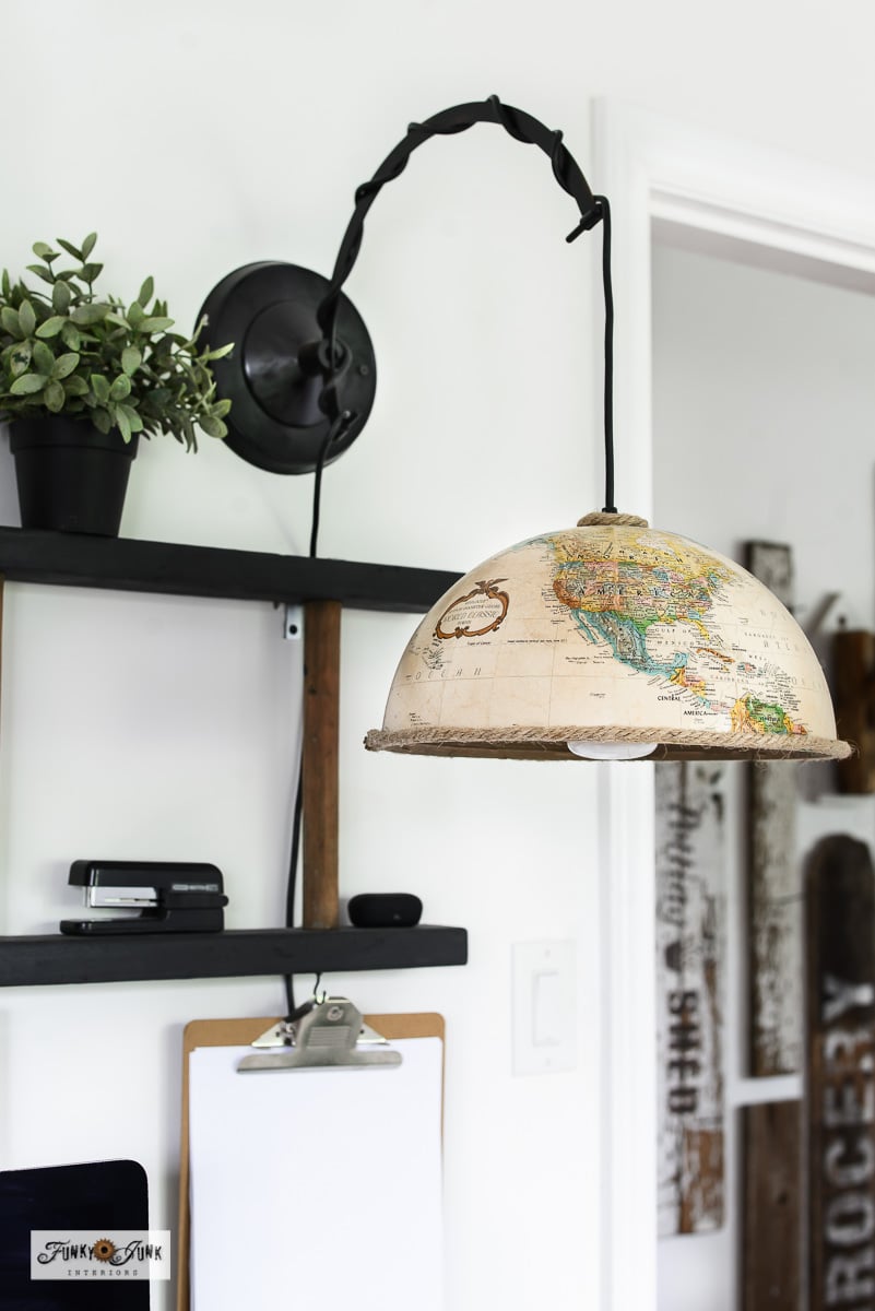 upcycled globe pendant light in an office