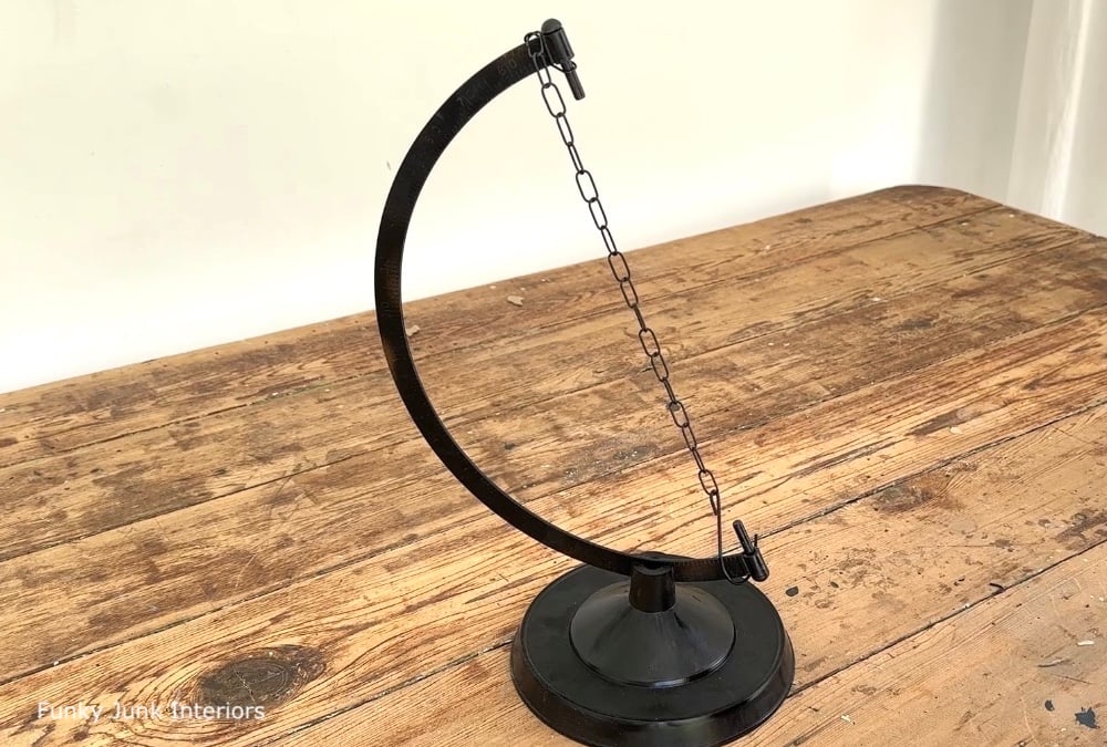 black upcycled globe paper towel stand