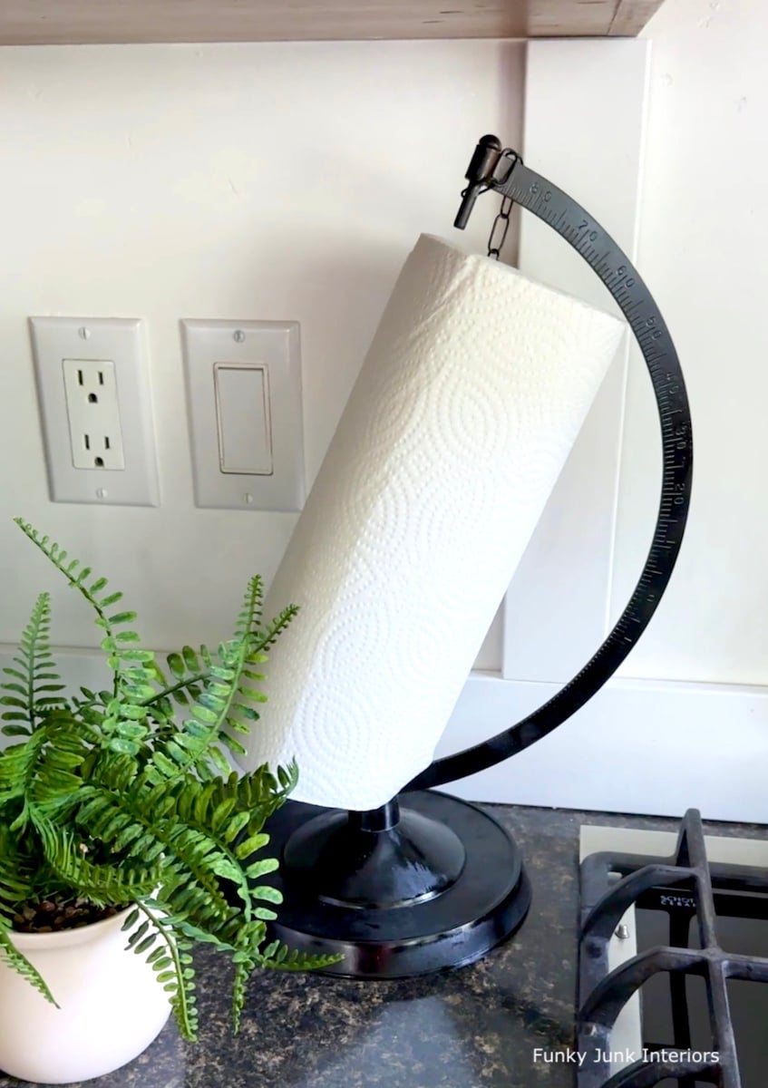 black upcycled globe paper towel stand