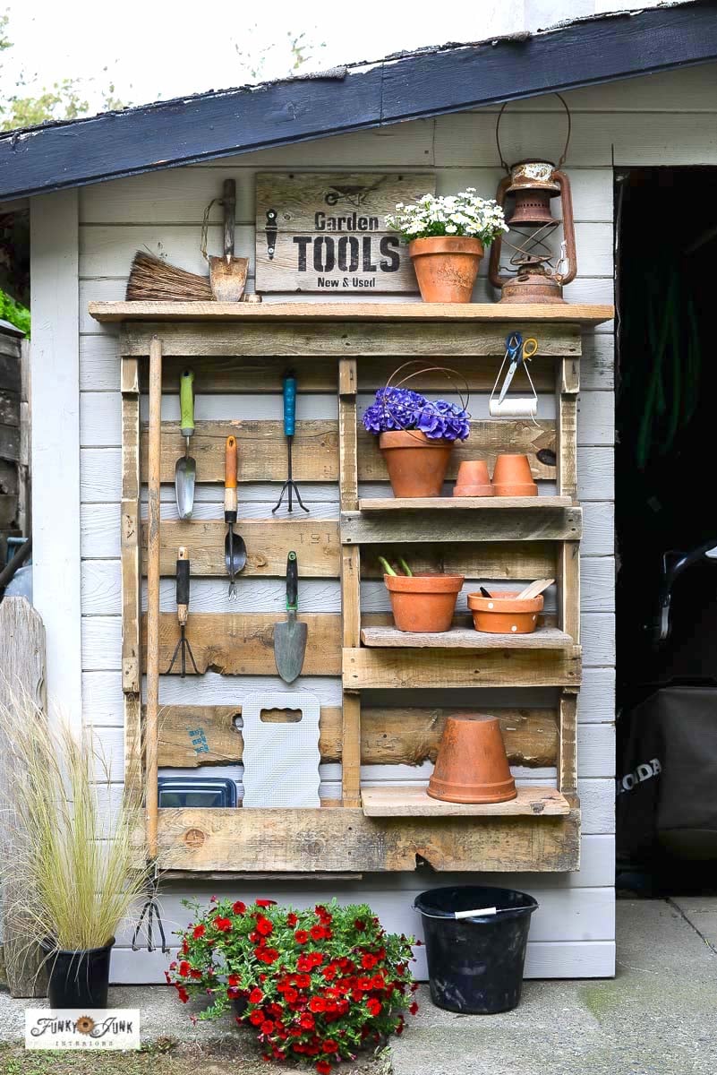 Organize your garden tools effortlessly with this DIY-friendly pallet yard tool organizer featuring sturdy shelves and handy hooks, perfect for keeping your yard tidy and tools within easy reach!