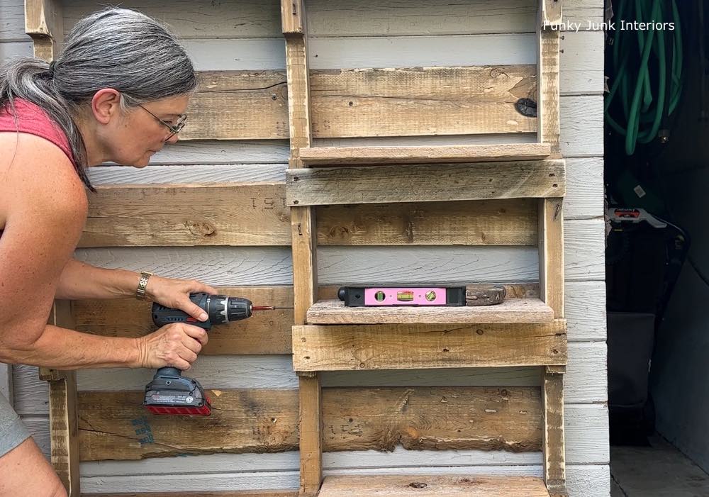 Screw in each shelf from the side of the pallet