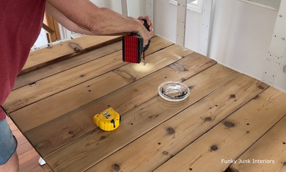 attaching wood for the top of a farmhouse dining table made from a picnic table