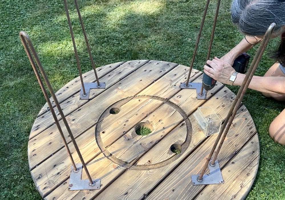 attaching pin legs to a cable reel top for an outdoor table
