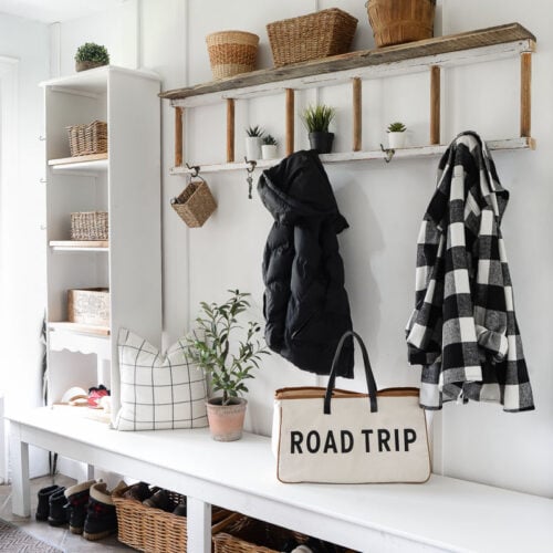 ladder coat rack with a shelf and basket storage