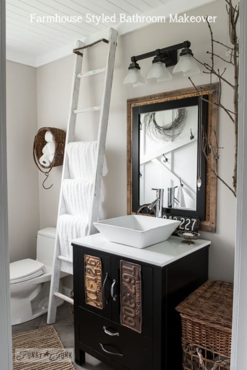 Farmhouse bathroom makeover, with ladder towel bar, vintage window moulding, yardstick mirror