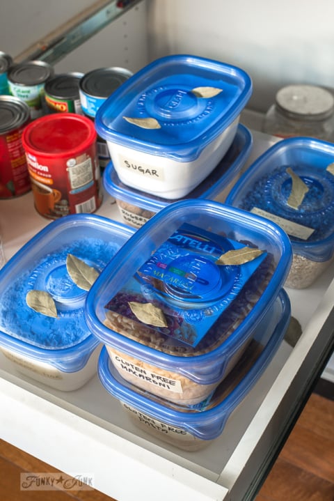 kitchen island pantry cleanup with bayleaves and airtight containers-003
