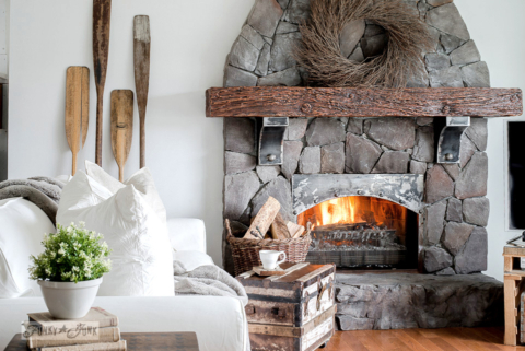 white ektorp Ikea sofas in a winter living room with wood oar wall decor-001
