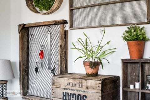 sewing desk with crates and antique soil sifters