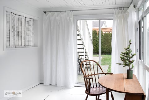 new sheet curtains on pipe rods in photo studio