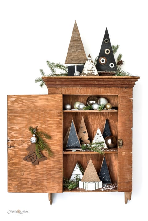 WWood Christmas trees in a vintage cabinet