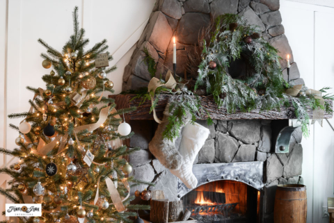 Rustic Christmas tree skirt using a cable spool beside a Christmas mantel