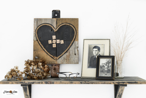 vintage valentine display with a wood heart and photos
