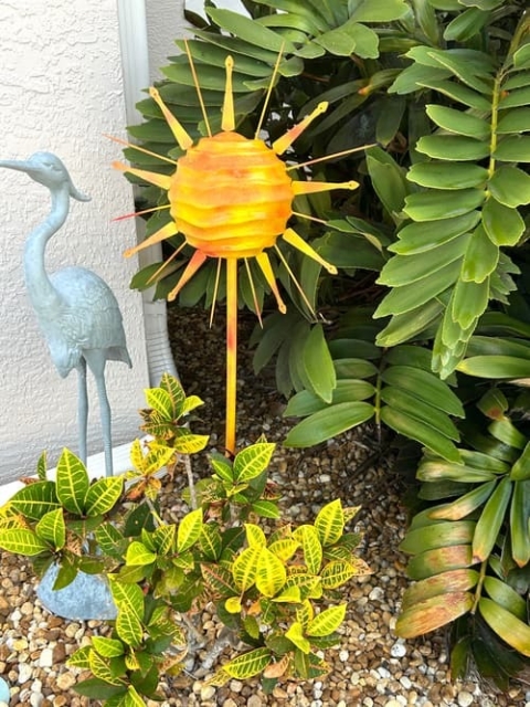 garden art from a Christmas ornament