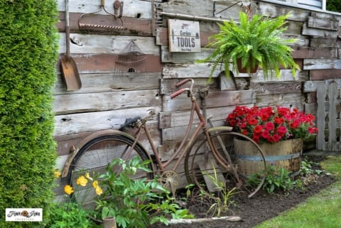 rusty bike and old garden tools as garden decorations16