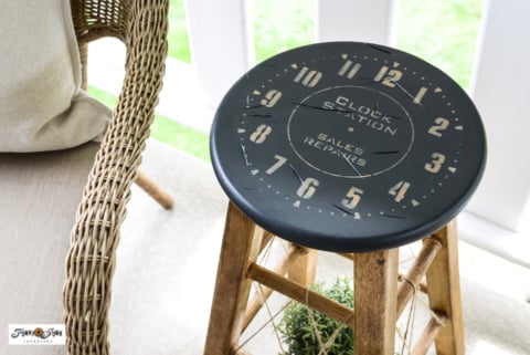 wooden stool makeover with clock seat and stained legs