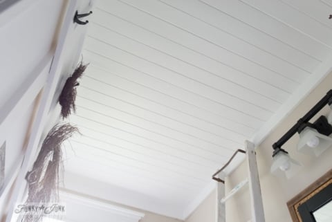 wood ceiling planks over a popcorn ceiling