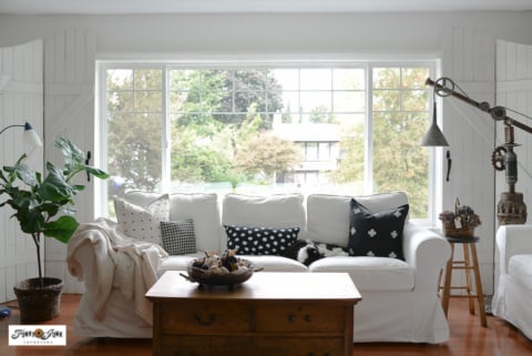 white ikea sofa in front of large picture window