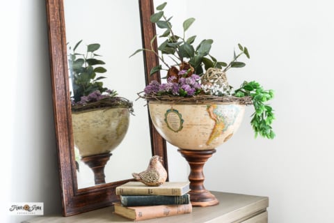 upcycled globe pedestal bowl filled with plants